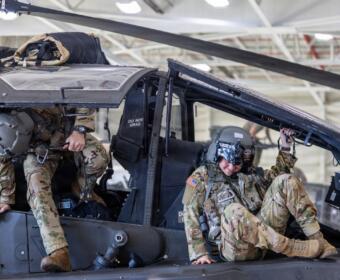 A 101st Combat Aviation Brigade pilot conducts egress testing from an AH-64 Apache helicopter while equipped with the Advanced Inflight Relief Universal System (AIRUS) at Fort Campbell, Oct. 5, 2026. (U.S. Army photo by Capt. Andrew Lightsey IV)