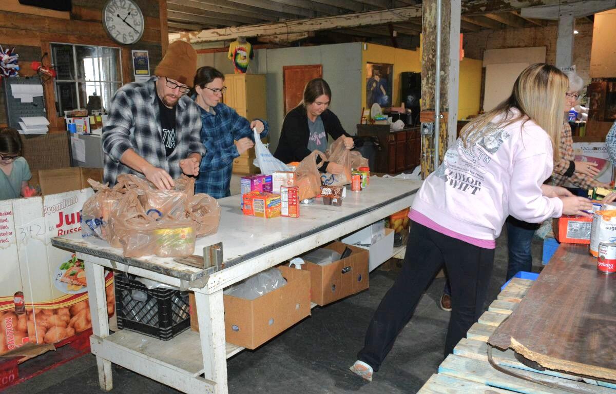 Manna Cafe volunteers collect and sort donated food for the 14th Annual Combat Hunger to support Manna Cafe Ministries on Nov. 11, 2023. (Lee Erwin)