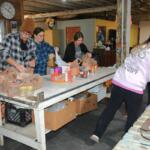 Manna Cafe volunteers collect and sort donated food for the 14th Annual Combat Hunger to support Manna Cafe Ministries on Nov. 11, 2023. (Lee Erwin)