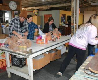 Manna Cafe volunteers collect and sort donated food for the 14th Annual Combat Hunger to support Manna Cafe Ministries on Nov. 11, 2023. (Lee Erwin)