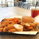 Combo meal at JP's Hot Chicken Clarksville location featuring their signature sandwich, and a side of fried pickles, Cajun fries and a sweet tea. (Christian Brown)