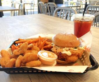 Combo meal at JP's Hot Chicken Clarksville location featuring their signature sandwich, and a side of fried pickles, Cajun fries and a sweet tea. (Christian Brown)