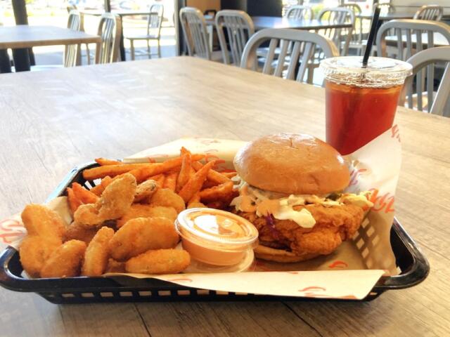 Combo meal at JP's Hot Chicken Clarksville location featuring their signature sandwich, and a side of fried pickles, Cajun fries and a sweet tea. (Christian Brown)
