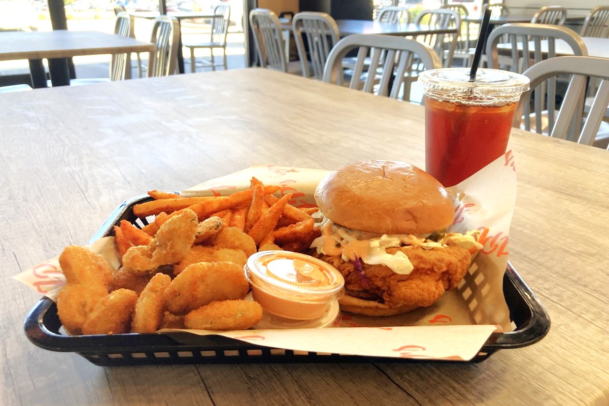 Combo meal at JP's Hot Chicken Clarksville location featuring their signature sandwich, and a side of fried pickles, Cajun fries and a sweet tea. (Christian Brown)
