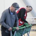 Volunteers set up beds in a Red Cross shelter. (Red Cross, contributed)