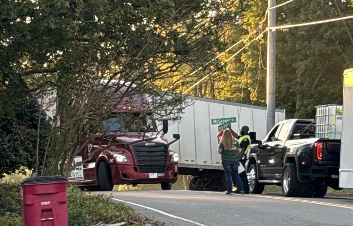 A semi is trapped by power lines at Hickory Grove Boulevard and McGregor Drive on Oct. 13, 2026. (Kendall Welsh, contributed)