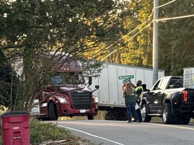 A semi is trapped by power lines at Hickory Grove Boulevard and McGregor Drive on Oct. 13, 2026. (Kendall Welsh, contributed)