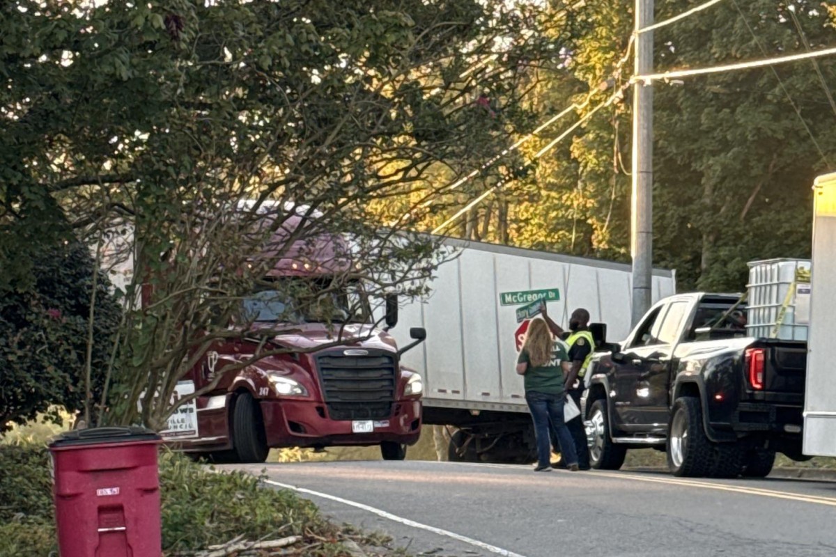 A semi is trapped by power lines at Hickory Grove Boulevard and McGregor Drive on Oct. 13, 2026. (Kendall Welsh, contributed)