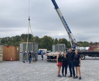 Trane's donation of five industrial AC units to the YAIPAK warehouse on Oct. 2, 2026. (Christian Brown)